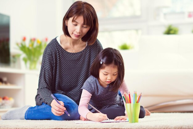 Portrait of smiling girl sitting at home