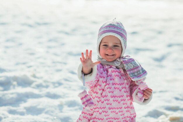 Portrait of a smiling girl in snow