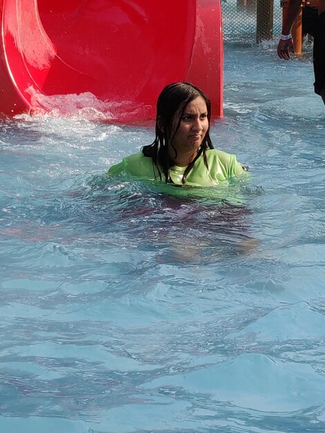 Portrait of smiling girl in swimming pool