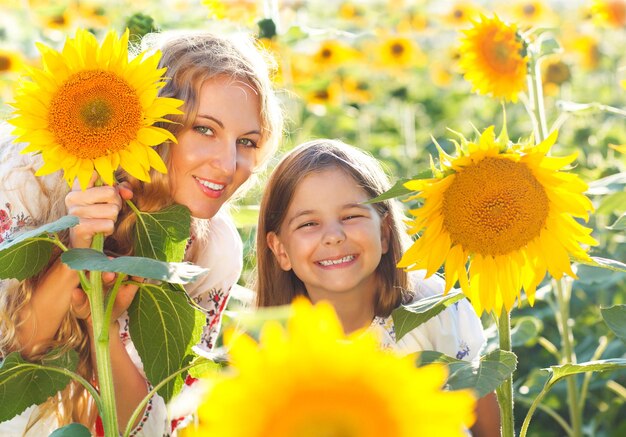 Portrait of smiling girl with sunflower