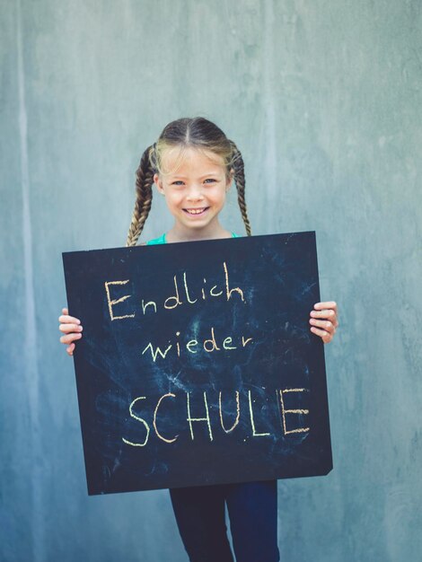 Photo portrait of a smiling girl with text