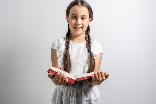 Portrait of a smiling little schoolgirl.