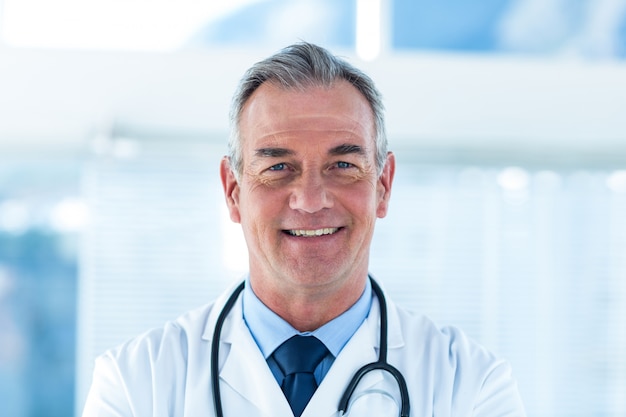 Portrait of smiling male doctor in hospital