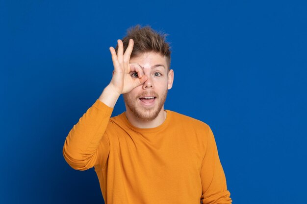 Portrait of smiling man against blue background