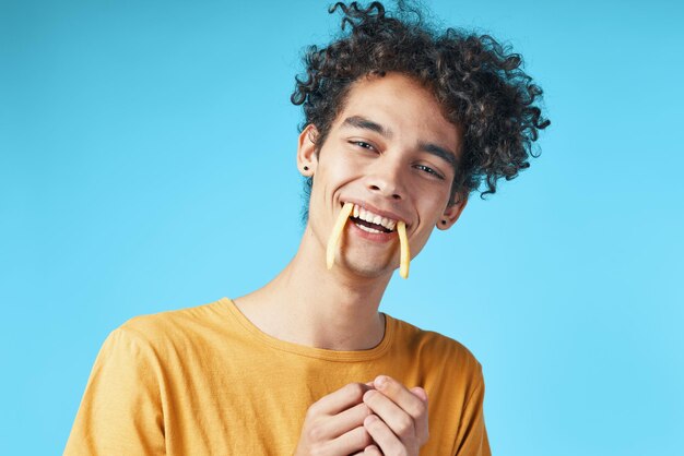 Portrait of smiling man against blue background