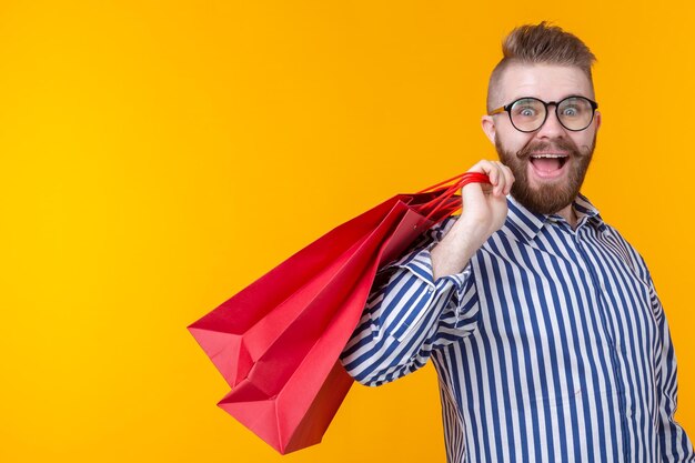 Portrait of smiling man against yellow background