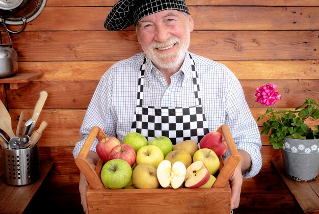 Portrait of smiling man holding fruits