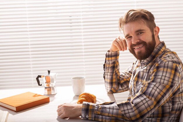 Portrait of smiling man sitting on table