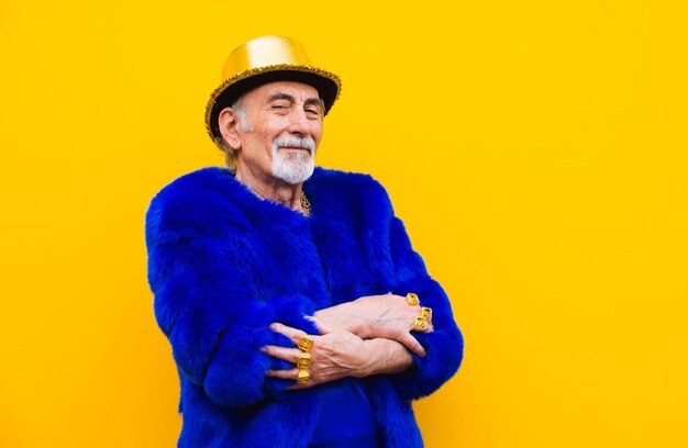 Portrait of smiling man standing against yellow background