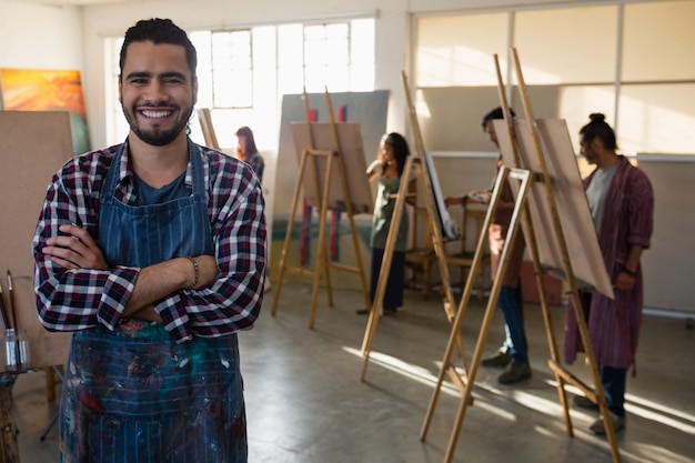 Portrait of smiling man with arms crossed