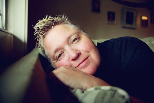 Portrait of smiling mature woman at home