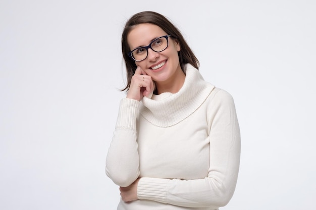 Portrait of smiling mature woman with glasses Studio shot