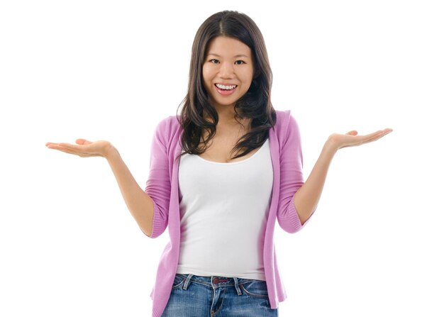 Portrait of smiling mid adult woman standing against white background