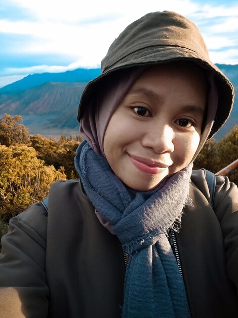 Portrait of smiling mid adult woman in winter