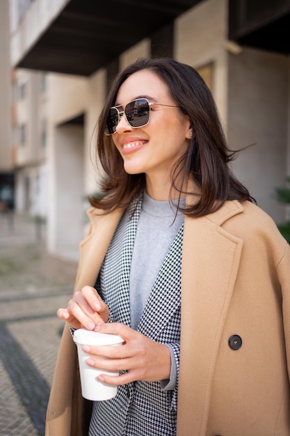 Portrait smiling middle age woman in sunglasses