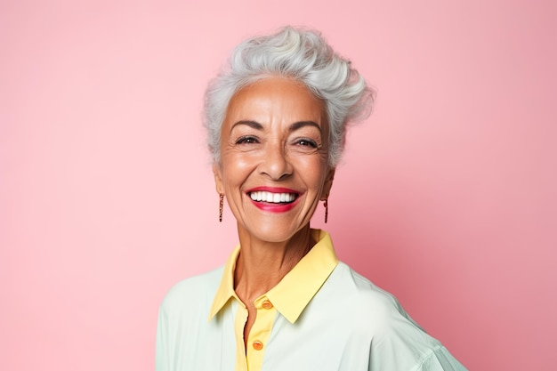 Portrait of a smiling middleaged LatinoAmerican woman on a pink background