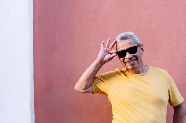 Portrait of a smiling older man with sunglasses