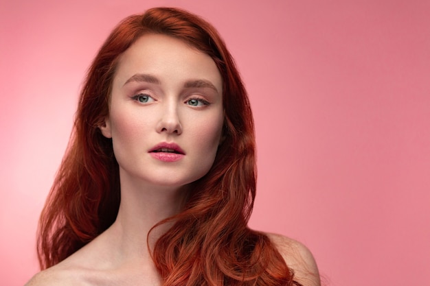 Portrait of smiling redhead girl.