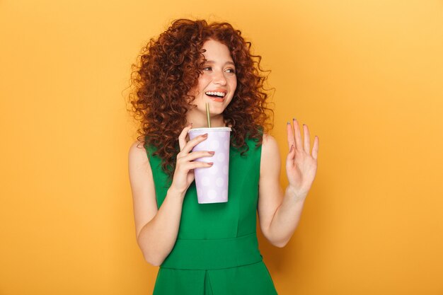 Portrait of a smiling redhead woman in dress