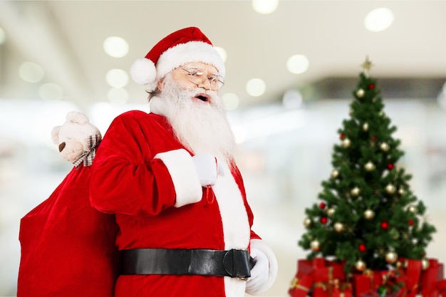 Portrait of smiling santa claus on  background