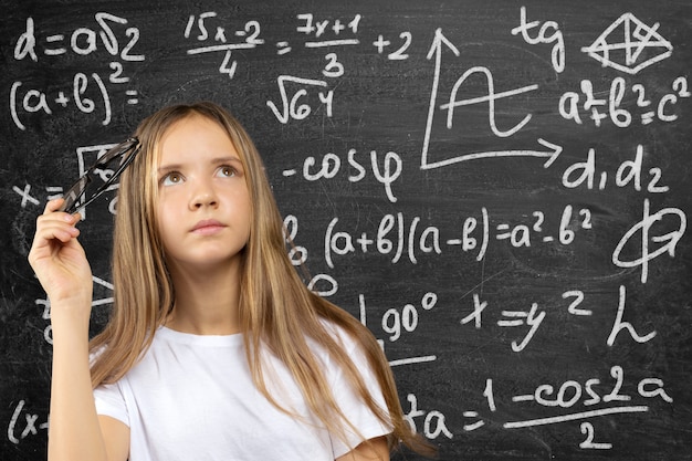 Portrait of smiling school girl child  in class