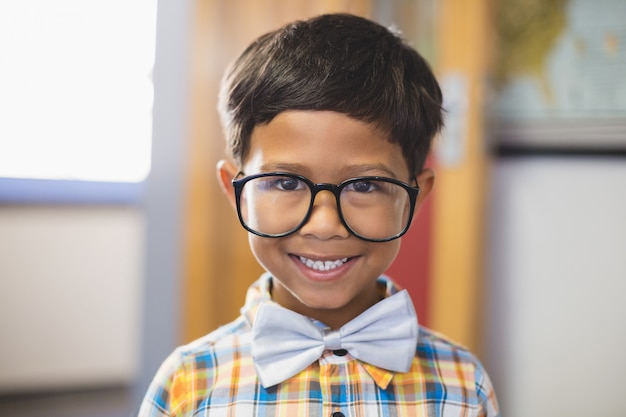 Portrait of smiling schoolboy in spectacle