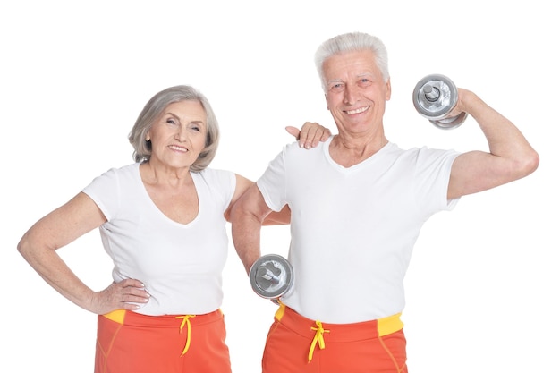 Portrait of a smiling senior couple exercising