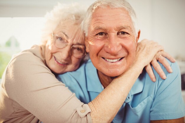 Portrait of smiling senior couple at home