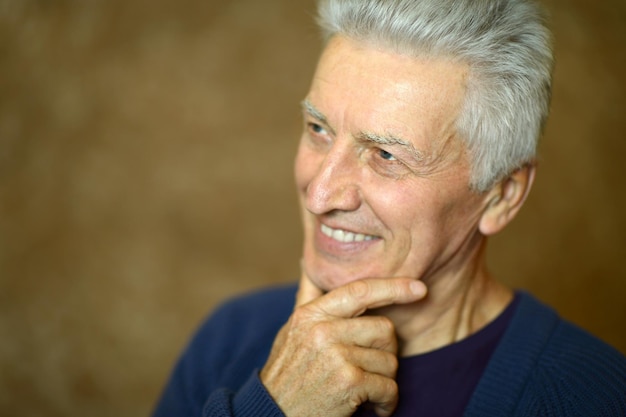 Portrait of a smiling senior man close up