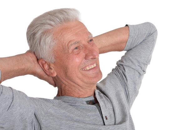 Portrait of smiling senior man isolated on white background