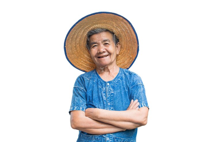 Photo  바탕 에 서 있는 모자를 입은 미소 짓는 고령 여성 의 초상화