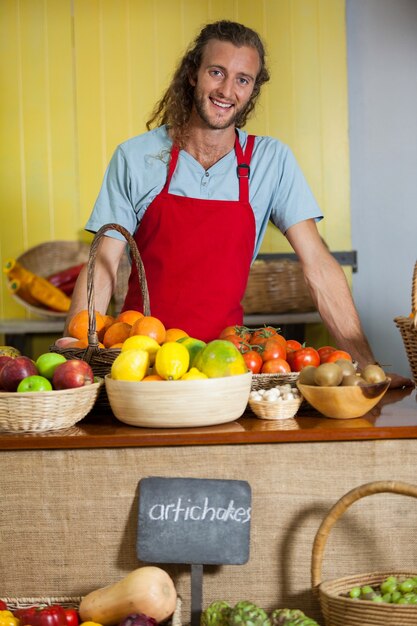 Portrait of smiling staff standing at counter