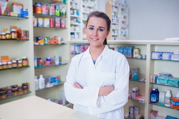 Portrait of a smiling student in lab coat looking at camera