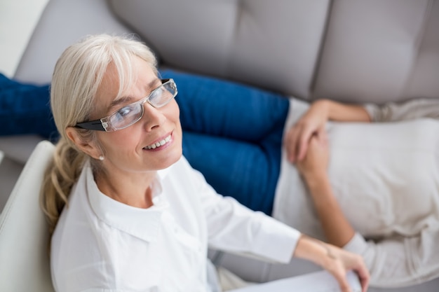 Portrait of smiling therapist by woman