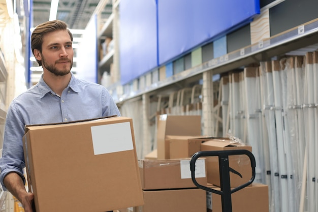 portrait of a smiling warehouse keeper at work.