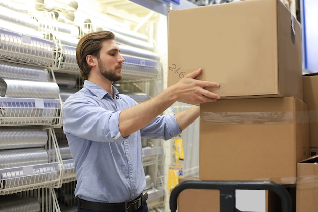 Portrait of a smiling warehouse keeper at work.