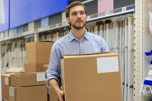 Portrait of a smiling warehouse keeper at work.