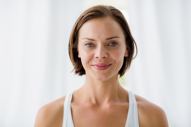 Portrait of smiling woman in fitness studio