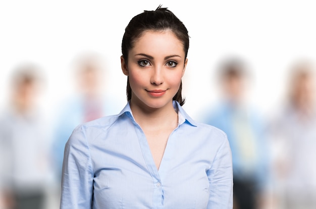 Portrait of a smiling woman in front of a group of people