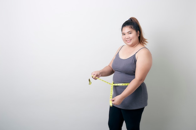 Portrait Of Smiling Woman Holding Tape Measure White