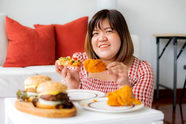 Portrait of a smiling woman sitting at home