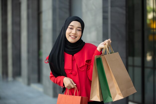 Portrait of smiling woman standing in city