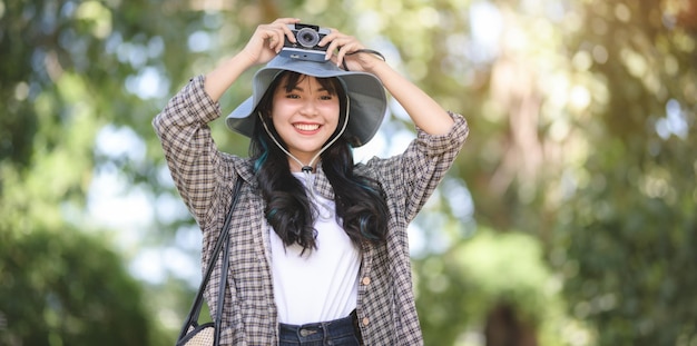 Portrait of smiling woman standing outdoors