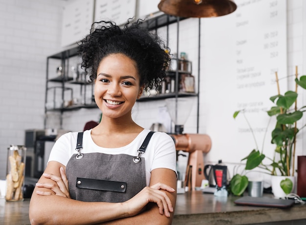 Portrait of smiling woman standing in restaurant