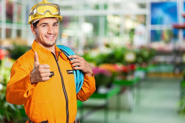 Portrait of a smiling worker. Isolated on white