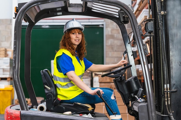 Portrait of a smiling worker posing during work in a warehouse