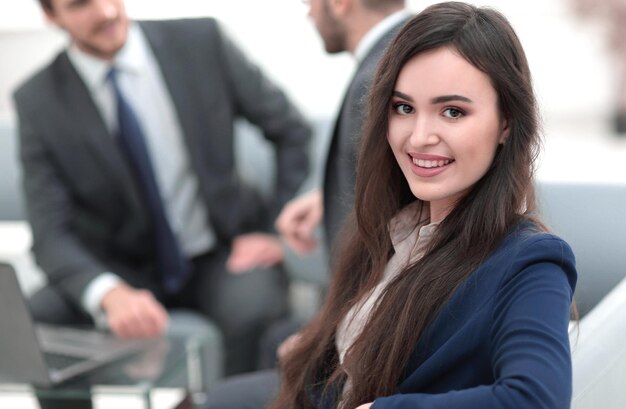 Portrait of smiling working girl in meeting