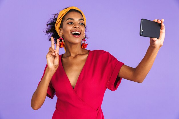 Portrait of a smiling young african woman in headband