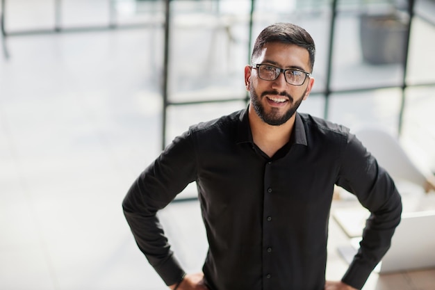 Portrait of smiling young businessman in office