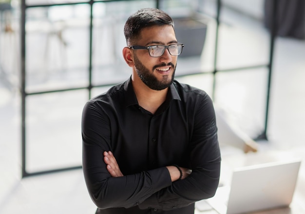 Portrait of smiling young businessman in office